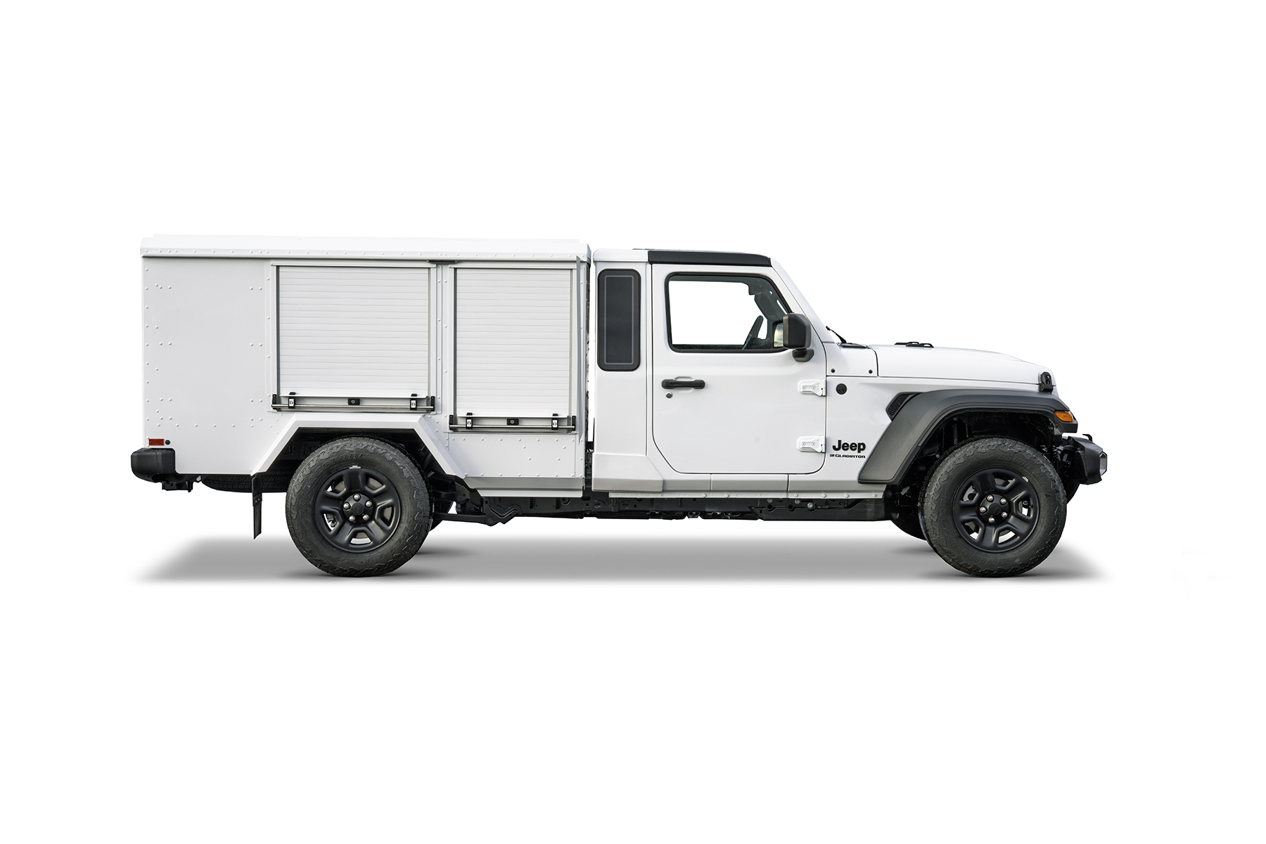 White Jeep Gladiator pickup with a large utility cargo box mounted in the truck bed on a white background
